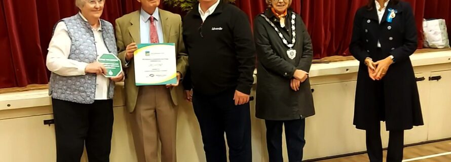 Mr Paul Ashman, Community Engagement Manager for idverde, presents idverde plaque to Elaine and Paul Bancroft who are proactive villagers in Urchfont.  They are watched by Dr Olivia Chapple OBE EMH, High Sheriff of Wiltshire, and Cllr Bridget Wayman, Chairman of Wiltshire Council.