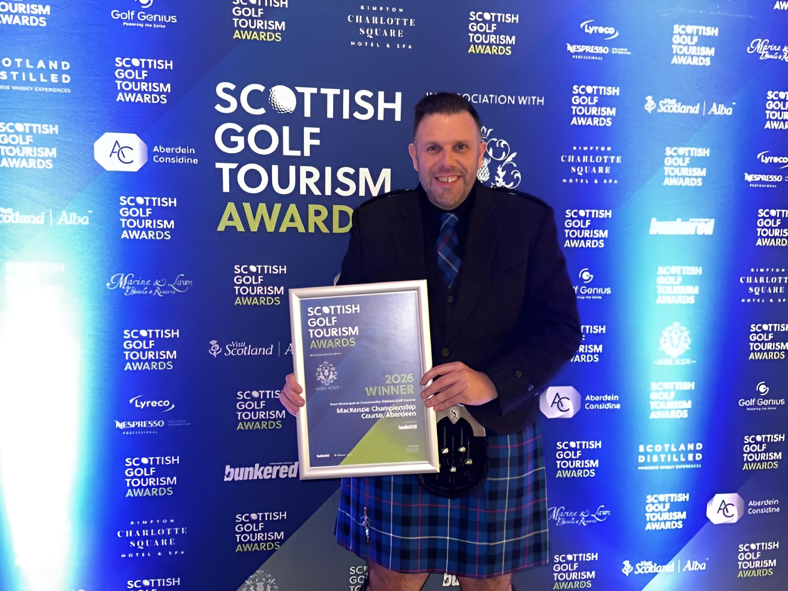 Man in Scottish kilt holding 2026 Scottish Golf Tourism Awards winner certificate at awards ceremony backdrop.