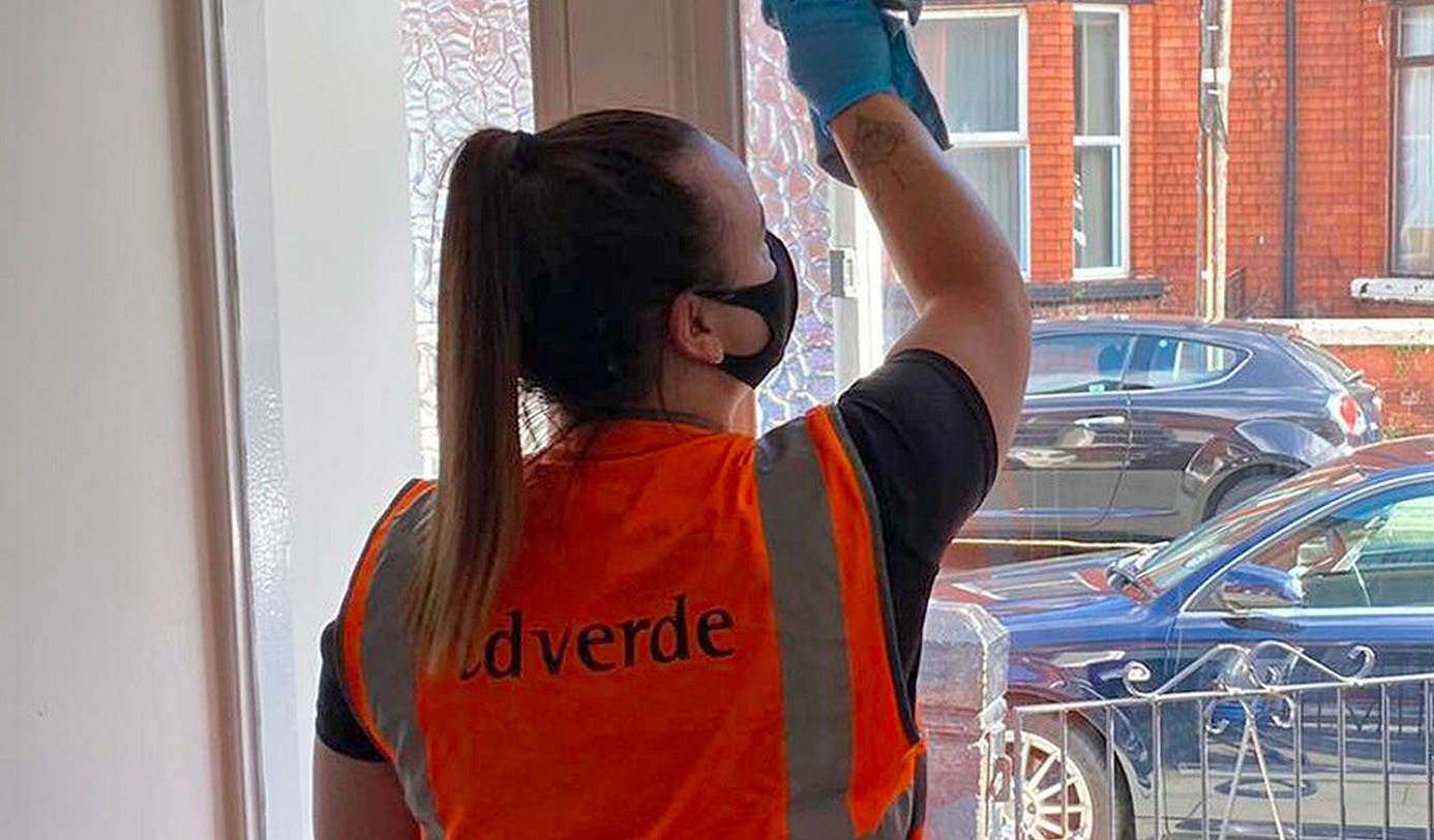 idverde operative cleaning an interior window frame in a residential property