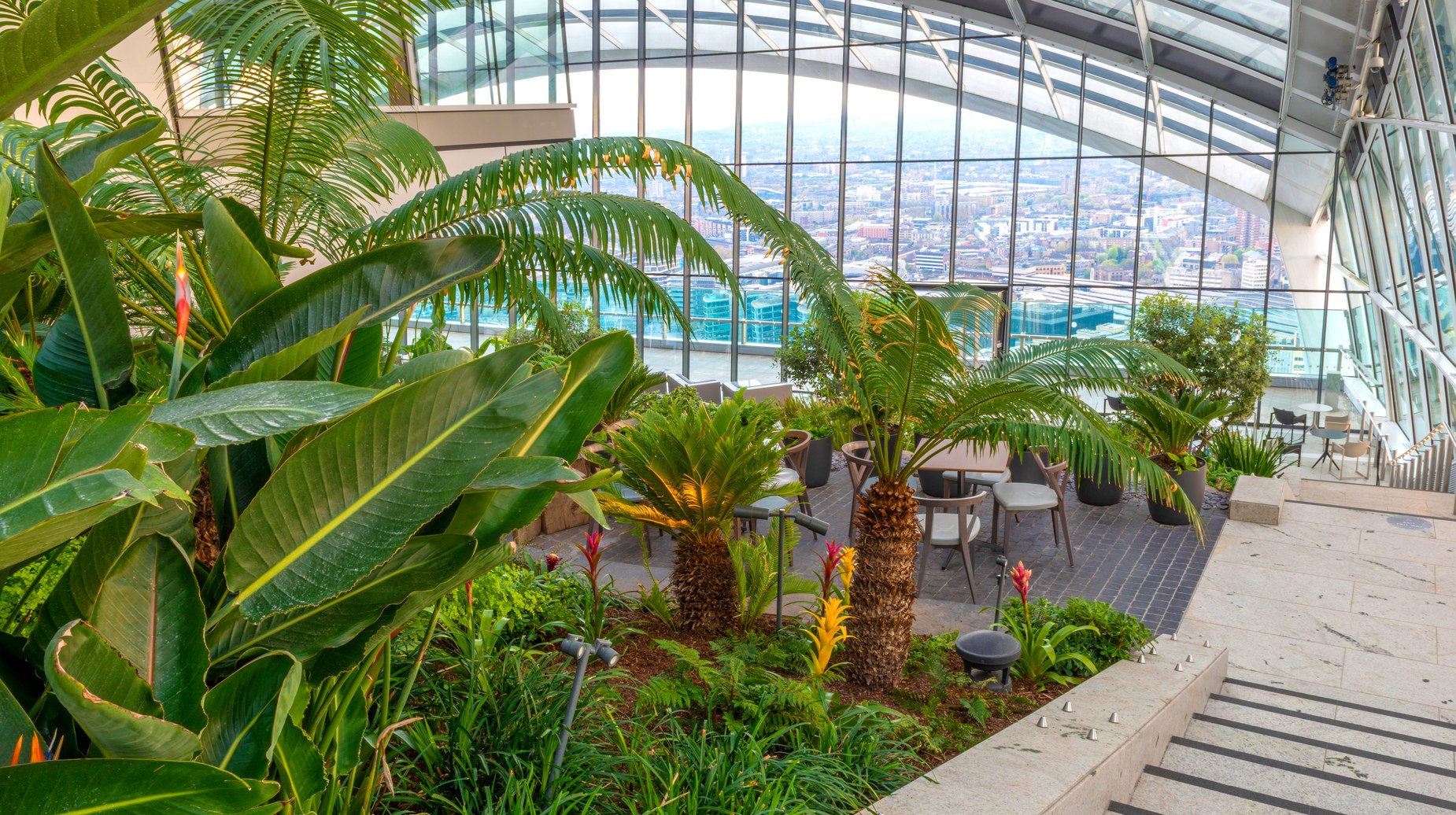Sky Garden terrace with tropical plants overlooking London skyline